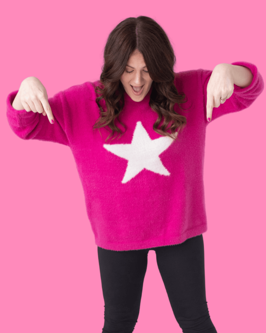 Emily in pink shirt with white star pointing down