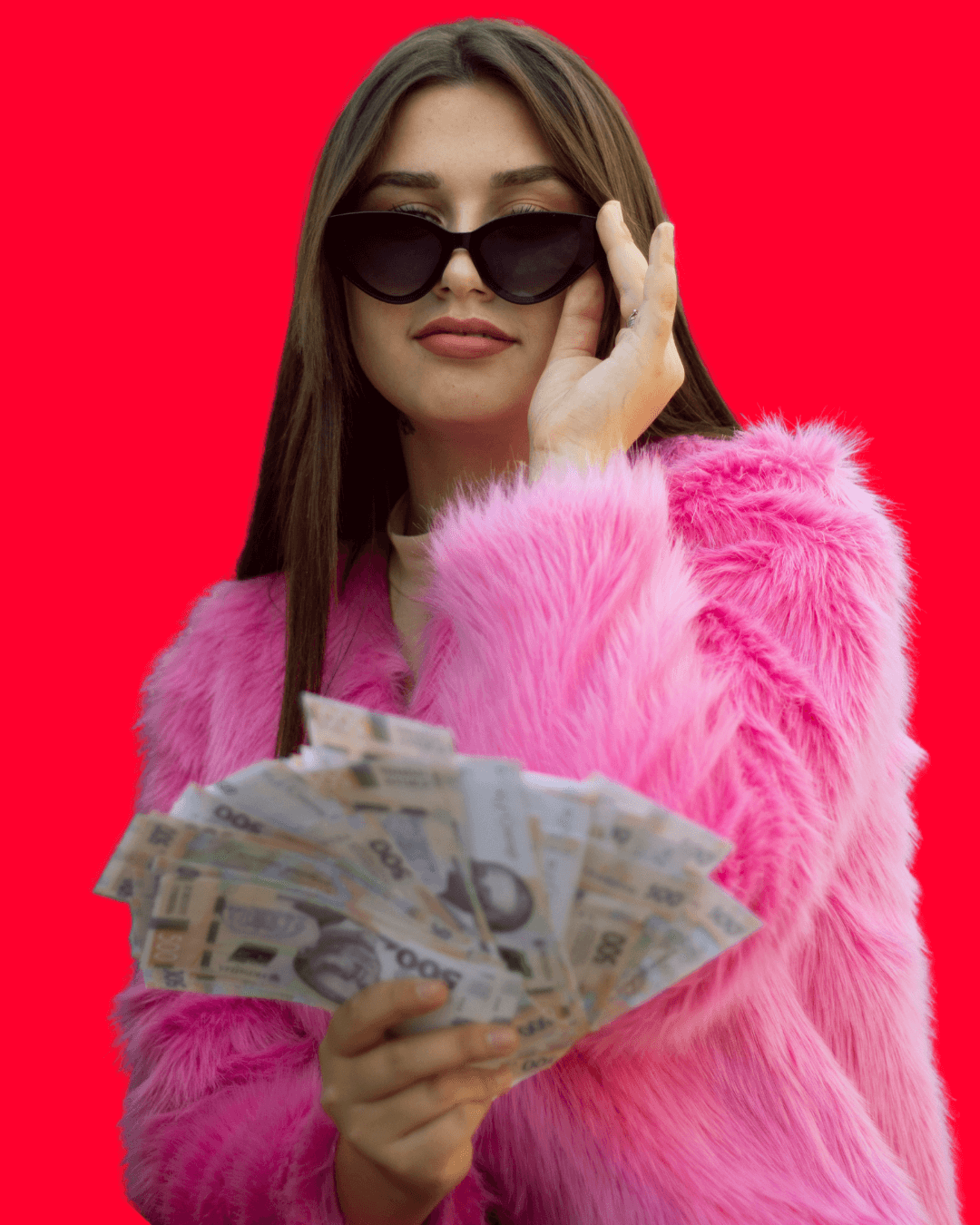 Woman in pink fuzzy jacket holding money